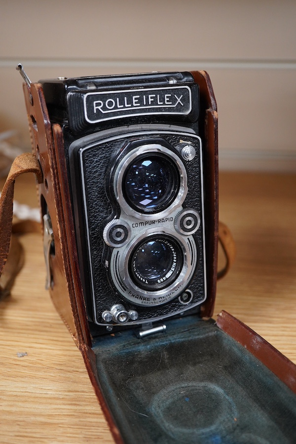 A mid 20th century German Franke & Heidecke Rolleiflex twin lens reflex camera in its original fitted leather case